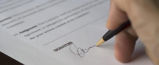 Pictured: signing a real estate lease. Many renters do not know you can re-negotiate the maintenance terms.