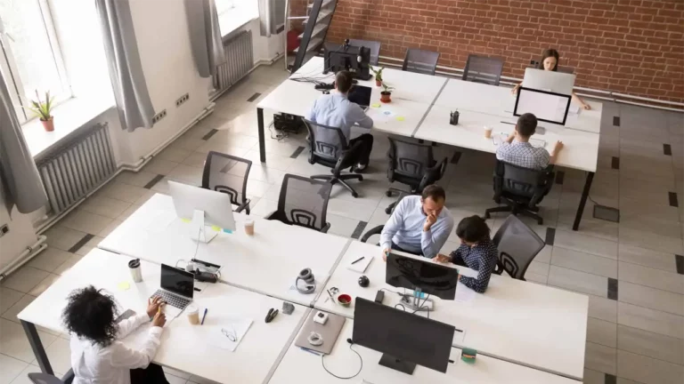 Employees working together in modern open office space
